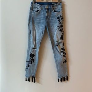 Light wash ripped black floral jeans